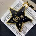 18K  Chanel Black Gold Star Brooch