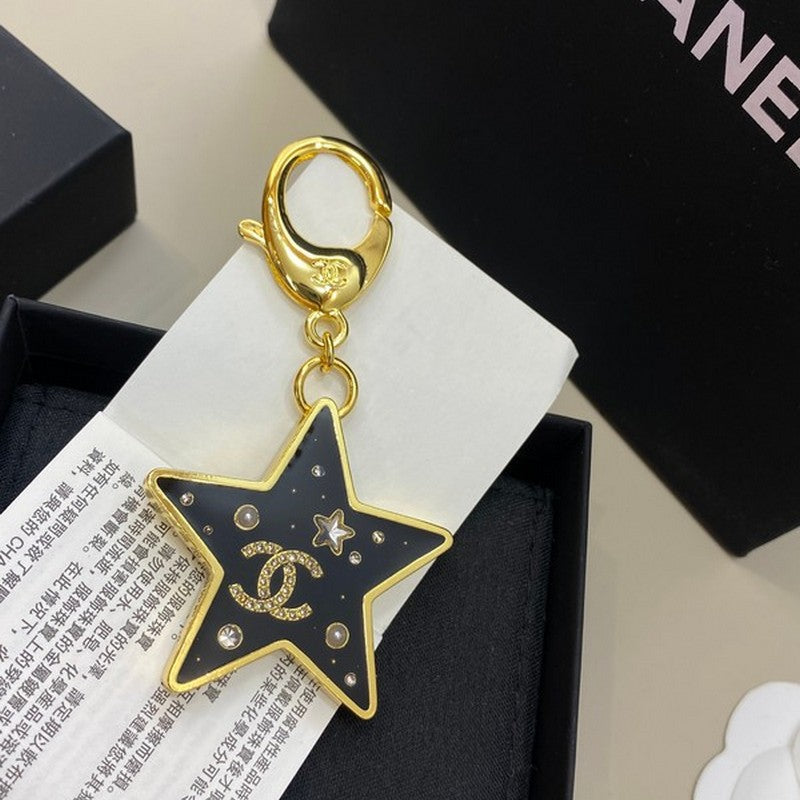 18K  Chanel Black Gold Star Brooch